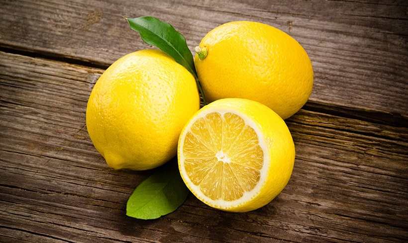 Lemons On Wooden Background